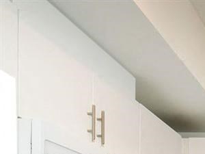 Spacious kitchen white them with stove microwave sink